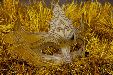 Beautiful New Year's carnival mask on tinsel.
