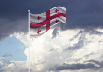 Flag of the Georgia, on a stick, dark clouds in the background