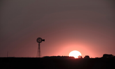 Windmill in countryside at sunset, Pampas, Patagonia,Argentina.