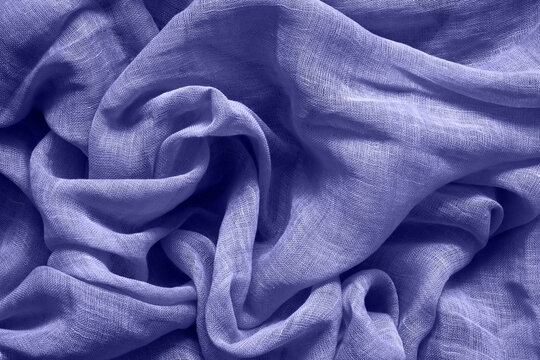Lilac very pery cotton fabric background. Color of the year 2022 toned.