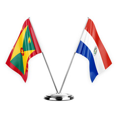 Two table flags isolated on white background 3d illustration, grenada and paraguay