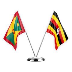 Two table flags isolated on white background 3d illustration, grenada and uganda