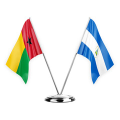 Two table flags isolated on white background 3d illustration, guinea-bissau and nicaragua