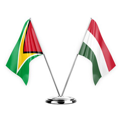 Two table flags isolated on white background 3d illustration, guyana and hungary