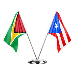 Two table flags isolated on white background 3d illustration, guyana and puerto rico