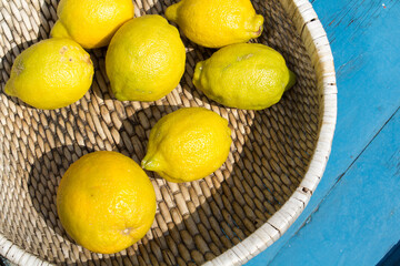Fototapeta Fresh lemons in a basket obraz