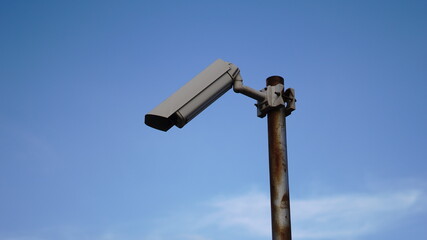 cctv camera pole against sky