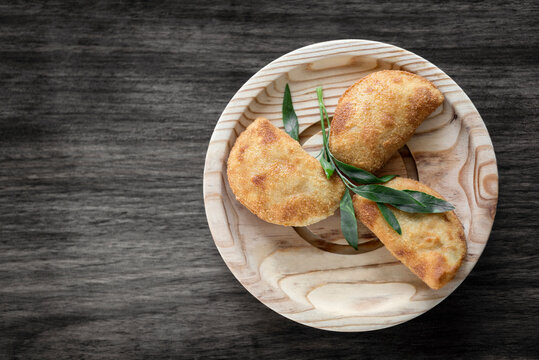 traditional brazilian beef rissole fried tapas snack on wood plate