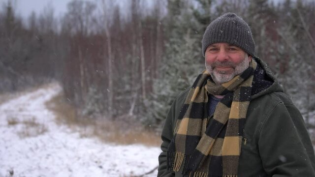 Portrait of a happy mature man outside on a cold winter day
