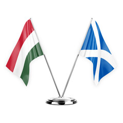 Two table flags isolated on white background 3d illustration, hungary and scotland