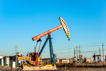 Oil pumps are running at the oil field.