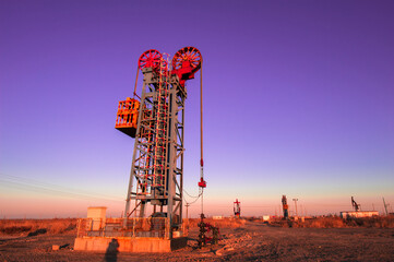 Oil pumps are running at the oil field.