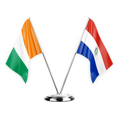 Two table flags isolated on white background 3d illustration, ivory coast and paraguay