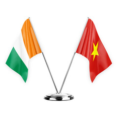 Two table flags isolated on white background 3d illustration, ivory coast and vietnam