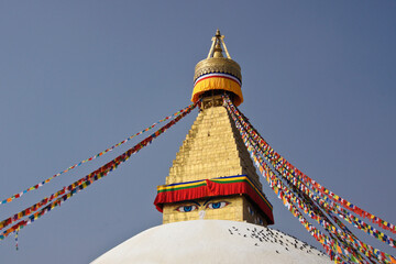 Boudhanath Tibetan Buddhist stupa with colorful prayer flags flying, Kathmandu, Nepal