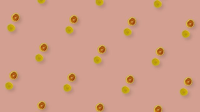 Colorful pattern of rotating dried grapefruits and oranges slices on pink background. Seamless pattern with dried grapefruit and orange chips. Pop art design. Realistic animation. 4K video motion