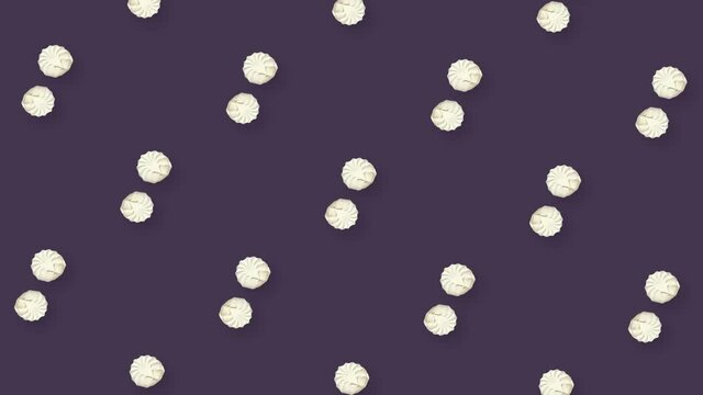 Colorful pattern of rotating zephyrs. Seamless pattern with zephyr. Marshmallow. Top view. Realistic animation. 4K video motion