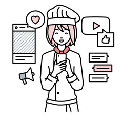 立ってスマートフォンでさまざまなSNSで楽しく交流する調理師の女性