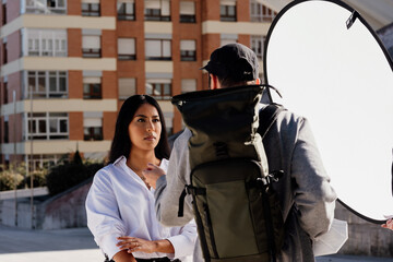 Young Latina model woman posing during a fashion themed photo shooting outdoors