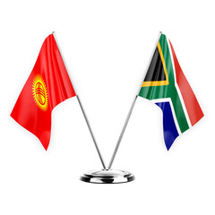 Two table flags isolated on white background 3d illustration, kyrgyzstan and south africa