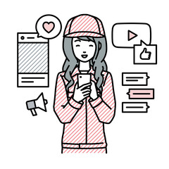 立ってスマートフォンでさまざまなSNSで楽しく交流する作業員の女性