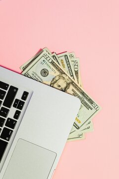 20 dollar US bills under a computer