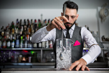 Bartender preparing a classis stirred cocktail