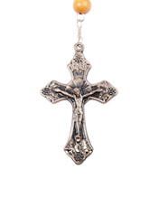 Silver crucifix close-up isolated on white background.