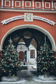 The Church of St. Igor of Chernigov's gate with two Christmas trees