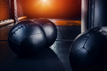 Black heavy weighted balls for gym workout.