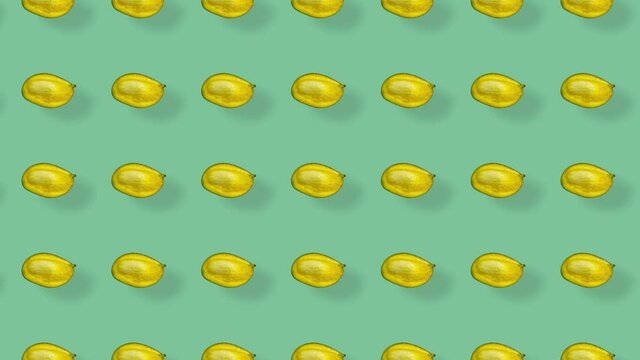 Colorful fruit pattern of fresh mango on green background with shadows. Seamless pattern with mango. Realistic animation. 4K video motion
