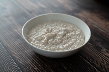 Obraz na płótnie Canvas Bowl of Nigerian Kunun Gyada - Spicy Peanut Rice Porridge