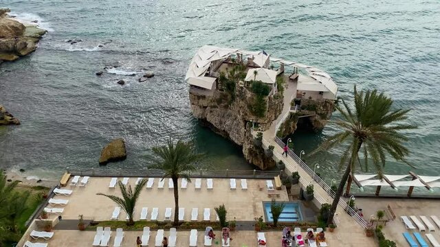 Vacationists On The Lounges At The Private Pool Of BOURJ AL FIDAR Resort In Jbeil, Lebanon. Tilt-up