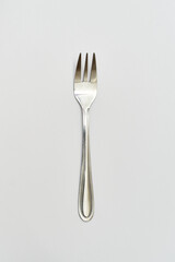Single fork on white background