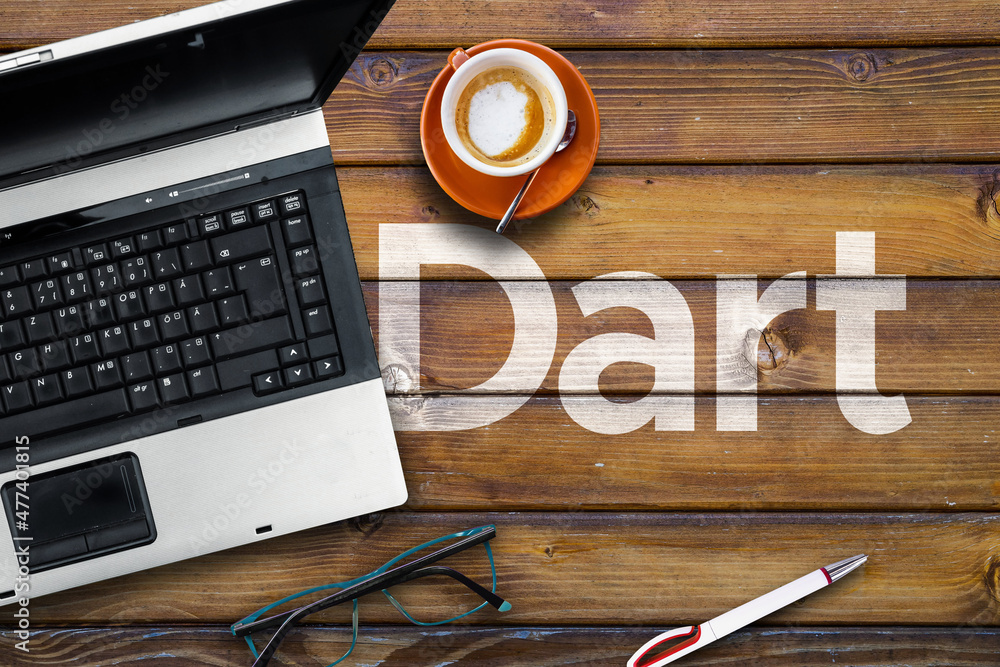 Aufkleber dart programming language. word dart on wooden desk and laptop