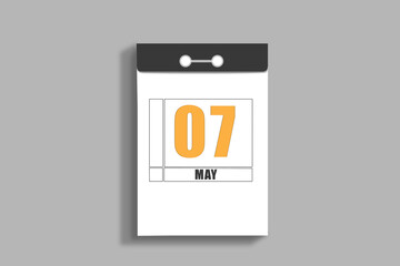may 7. 7th day of month, calendar date.White page of tear-off calendar, on gray insulated wall. Concept of day of year, time planner, spring month