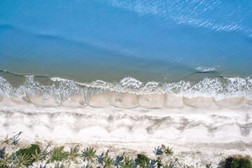 aerial view of the sea and ocean waves. The wind blows on the beaches in the evening of the islands...