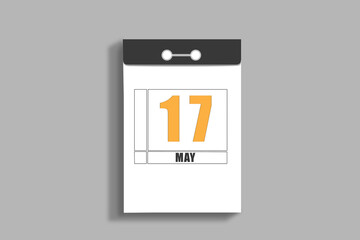 may 17. 17th day of month, calendar date.White page of tear-off calendar, on gray insulated wall. Concept of day of year, time planner, spring month
