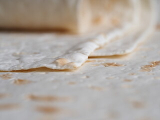 Refrained Asian Bread Lavash Close-up. yeast-free pita bread