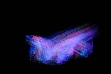 Light painting photography, abstract of purple, pink and blue lines clashing against a black background.