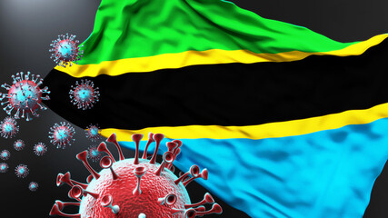 Tanzania United Republic of and the covid pandemic - corona virus attacking its national flag to symbolize fight with the virus in this country, 3d illustration
