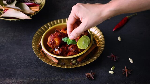 Fried chicken Kebab Kabab Chicken Tikka Masala woman hand serving chicken fry 4K video footage chicken 65 Bangalore Kerala Hyderabad South India Sri lankan Indian non veg food.
