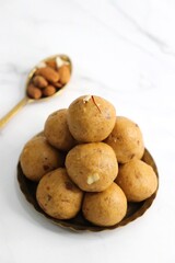 Indian Traditional Sweet Food Besan ke Laddu. Made using gram flour, sugar, and ghee. Indian festival sweet. Diwali faral or snacks. copy space. Gram flour sweet Ladoo. 