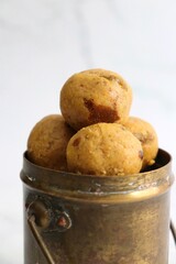 Indian Traditional Sweet Food Besan ke Laddu. Made using gram flour, sugar, and ghee. Indian festival sweet. Diwali faral or snacks. copy space. Gram flour sweet Ladoo. 