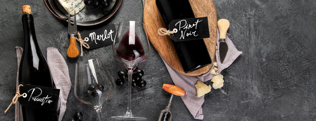 Fototapeta Red wine assortment with appetizers on gray background. obraz