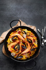Seafood Paella on gray background.