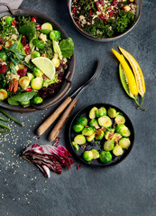 Vegan dishes assortment on gray background.