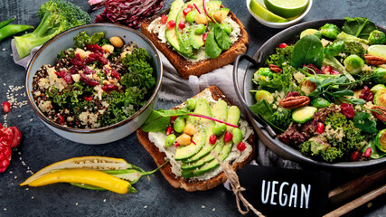 Vegan dishes assortment on gray background.