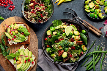Vegan dishes assortment on gray background.