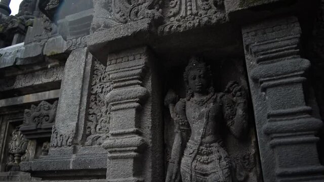 The detailed medium shot of the Prambanan statue. Prambanan Temple is an 8th-century Hindu temple compound in the Special Region of Yogyakarta, Indonesia, dedicated to the Trimūrti.